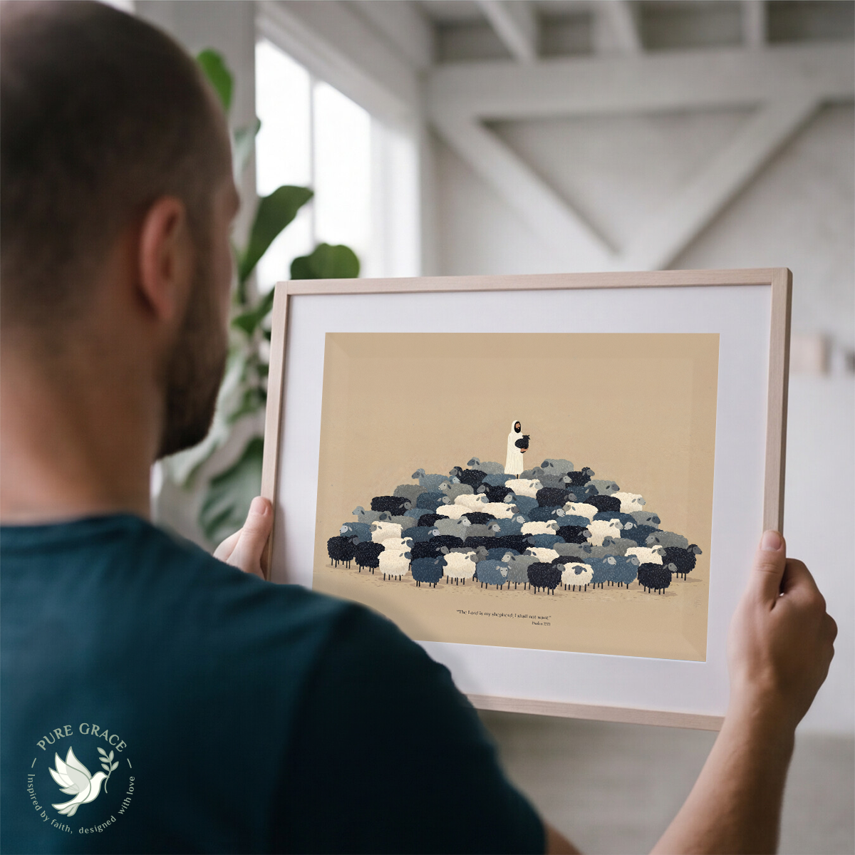 Person holding a framed artwork of a sheep and lamb illustration.