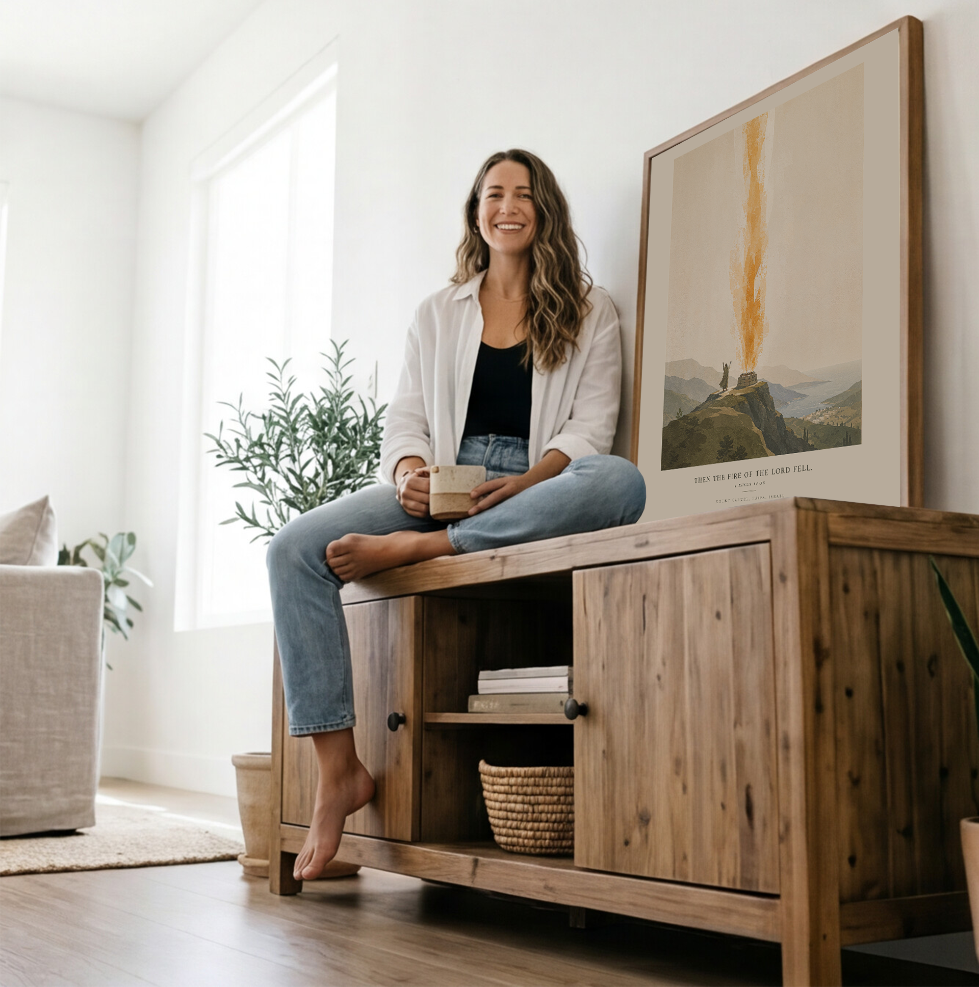 Woman sitting on a wooden cabinet in a bright living room with plants and artwork.